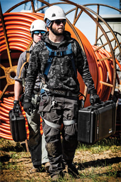 Rigid weapon transport cases carried by two equipped security operators